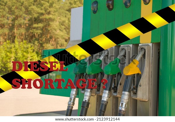 Gas station closed. Petrol pump not work. Black\
and yellow line of barrier tape forbids passage. For repairs,\
maintenance, fuel drain, strike. Global diesel shortage. Concept\
for crisis in industry.