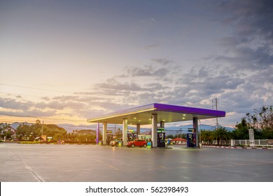 gas station with clouds and sky at sunset