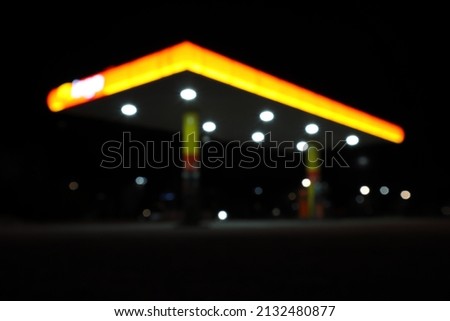 Gas station at night. Abstract Out of Focus. Underexposed. Black background or sky. Stockholm, Sweden, Europe.