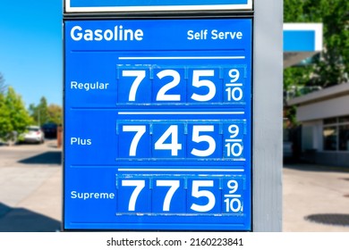 Gas station price sign showing record high gasoline prices for over 7 dollars a gallon of regular gas. - Shutterstock ID 2160223841