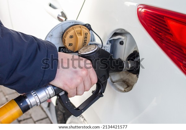 Gas station - refueling.To\
fill the machine with fuel. Car fill with gasoline at a gas\
station.