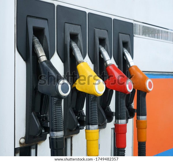 Gas station.\
Refueling pistols close-up. Fuel cost. Diesel and gas prices. Fuel\
pumps at a gas station