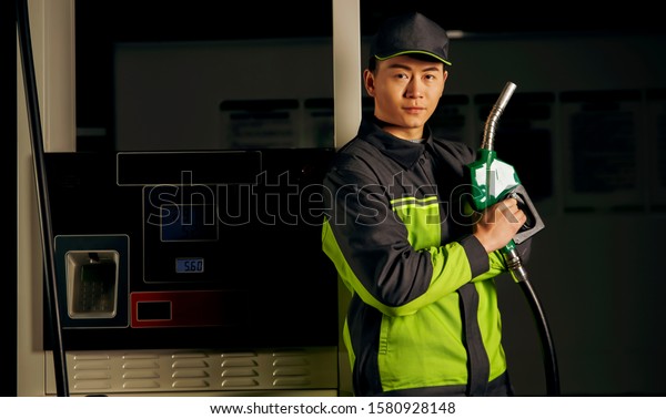 Gas station\
service staff working late at\
night