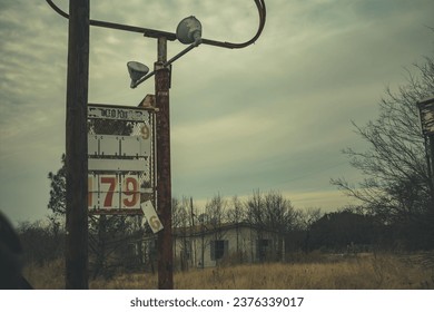 Gas station sign in a ghost town