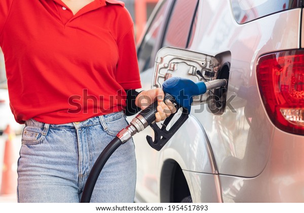 Gas station staff worker service\
working refill cars gasoline engine fuel to\
traveller