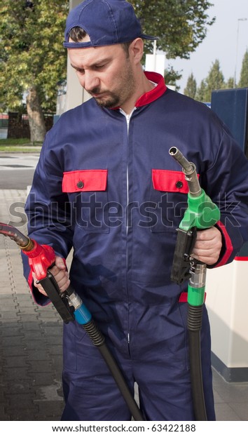Gas
Station Worker Refilling Car at Service
Station