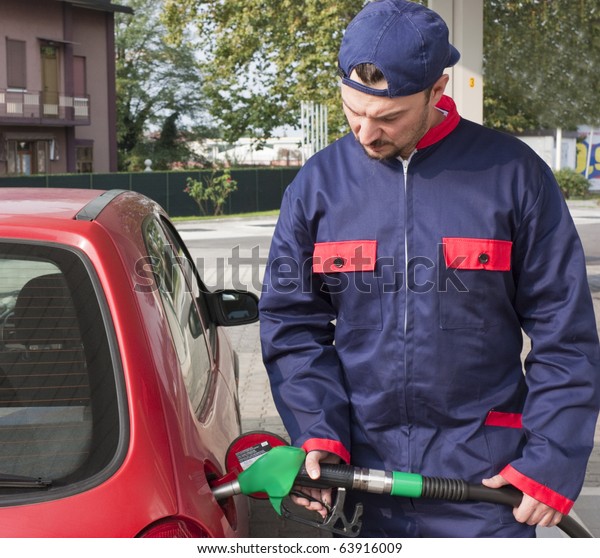 Gas\
Station Worker Refilling Car at Service\
Station