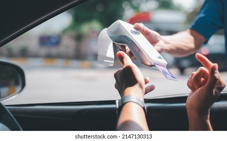 Gas Station Worker Swipe Mockup Credit Card Via Payment Terminal After Giving A Price Quote To The Customer Sitting In The Car.