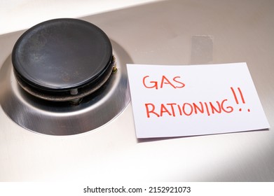 Gas stove, with blank note next to it with the text "gas rationing". Rationing and insufficiency in gas flows. Energy crisis.
 - Shutterstock ID 2152921073