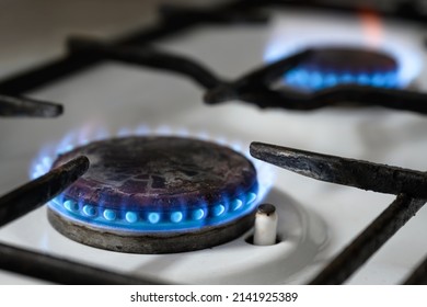 Gas Stove At Home, Natural Gas Burns In Kitchen, Blue Fire Flame Of Burners For Cooking. Concept Of Russia And Europe Economy, Home Propane Cost, Heat, EU Sanctions, Crisis, Embargo And Warmth.