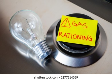 Gas stove, with yellow note next to it with text "gas rationing" and light bulb off. Rationing and insufficiency in gas flows. Energy crisis.
 - Shutterstock ID 2177814369
