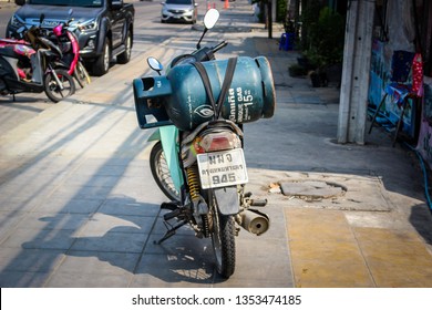 Gas tank carry on a motorcycle, unsafe transportation, Bangkok, Thailand. On Mar 23, 2019.