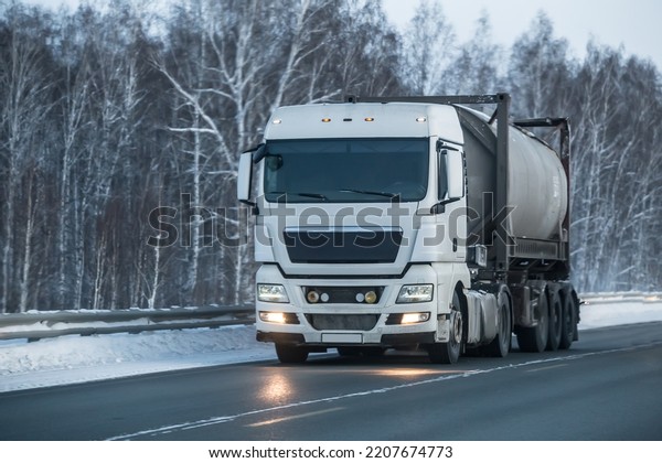 Gas\
transportation system on truck moving on a snowy\
road