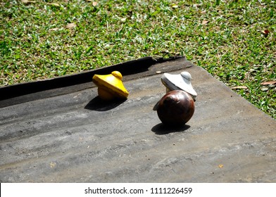 Gasing Or Tops Spinning. The Traditional Games Popular Among Malaysian Malay. Especially Among The Villagers In The State Of Kelantan And Melaka. 