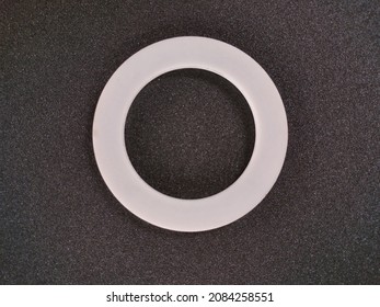 
Gasket Or Packing Product Is White With A Circle Made Of Teflon On A Black Background