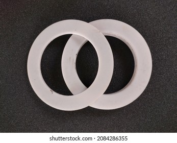 

Gasket Or Packing Product Is White With A Circle Made Of Teflon On A Black Background

