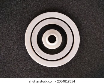 Gasket Or Packing Product Is White With A Circle Made Of Teflon On A Black Background

