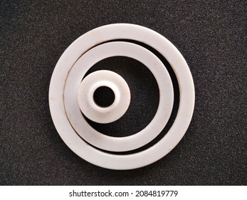 Gasket Or Packing Product Is White With A Circle Made Of Teflon On A Black Background

