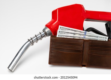 Gasoline Fuel Nozzle And Wallet With Cash Money. Gas Price, Tax, Ethanol And Fossil Fuel Concept