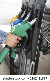 
Gasoline Gun In A Hand At A Gas Station