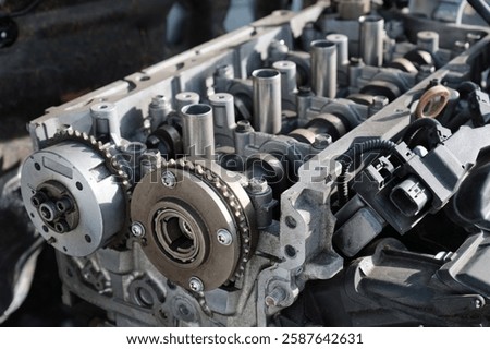 Gasoline internal combustion engine disassembly for repair in a passenger car. Selective focus.