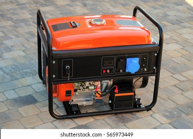 Gasoline portable generator for electric power supplies - Shutterstock ID 565973449