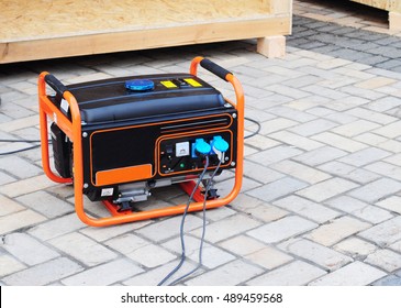  Gasoline Portable Generator on the  House Construction Site. Close up on Mobile Backup Generator .Standby Generator - Outdoor Power Equipment