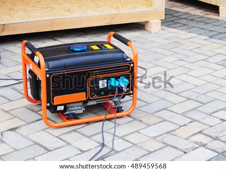  Gasoline Portable Generator on the  House Construction Site. Close up on Mobile Backup Generator .Standby Generator - Outdoor Power Equipment