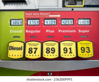 A gasoline pump showing digital screens with prices for diesel and unleaded fuels - Shutterstock ID 2362009991