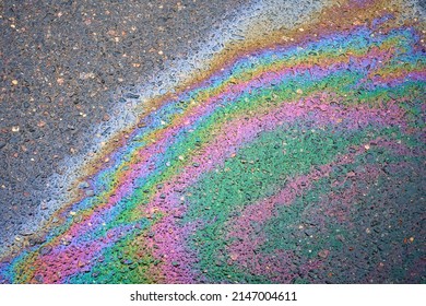 Gasoline Spill On The Pavement Resembling A Rainbow