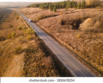 Gasoline Truck Oil Trailer, Truck On Highway Driving Along The Road. Tank Truck At Work Aerial View Above.