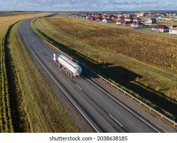 Gasoline Truck Oil Trailer On Highway Driving Along The Road. Aerial View Of Tank Vehicle At Work. Belgorod , Russia - SPT 2, 2021: