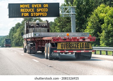 Gaston, USA - July 6, 2021: Interstate Highway I26 26 In South Carolina With Large Truck Trailer Sign For Oversize Load And Move Over Or Reduce Speed For Stopped Vehicles