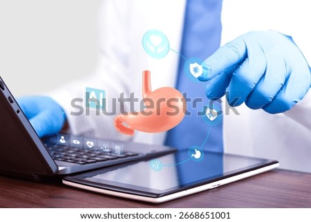 Gastroenterologist using artificial intelligence technology on a laptop for stomach diagnosis, digital health innovation in digestive medicine, smart healthcare, futuristic and telemedicine concept