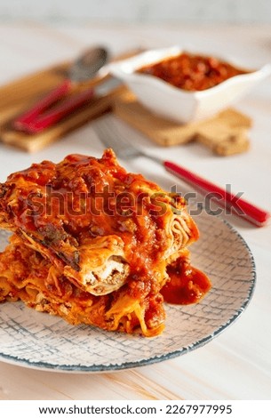 Gastronomic specialty italian baked pasta lasagna with meat ragu sauce, stuffed with ricotta and mozzarella