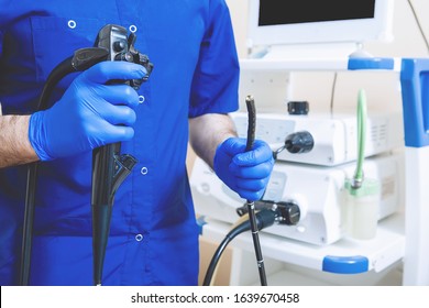 Gastroscopy, endoscopy. Hands of the Doctor at the ready for the operation Apparatus for cavity research: fibrogastroduodenoscopy, the study of the stomach