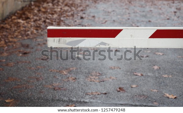 gate
barrier at car parking entrance, blurred
background