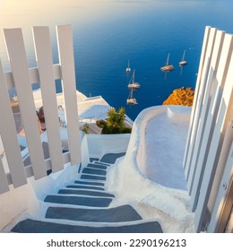 Gate to heaven. Santorini, Greece. White architecture, open doors and steps to the blue sea of Santorini. Holidays in Greece, Santorini. - Shutterstock ID 2290196213