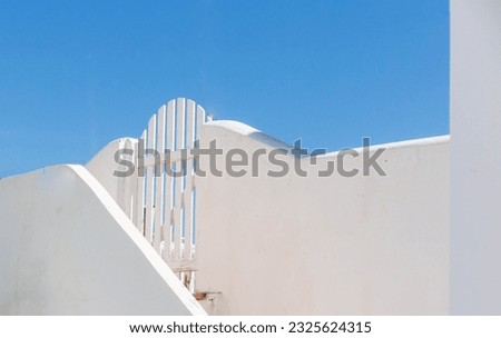 A gate image from Santorini which opens to the balcony of a Oia village house