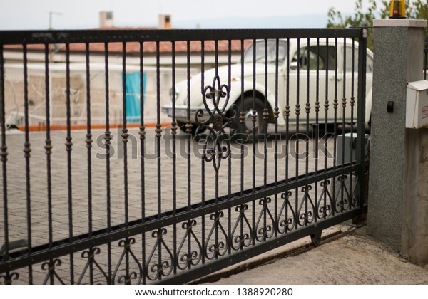 a gate with a nice
car
