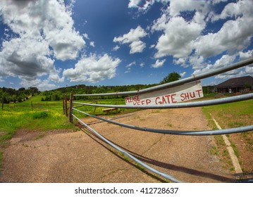 A Gate On A Farm In Rural Arkansas With A Sign That Reads 'please Keep Gate Shut'.