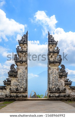 The gate overlooking the volcano of Pura Penataran Agung Lempuyang is a Balinese Hindu temple or Pura located on Mount Lempuyang hill in Karangasem Bali. Indonesia