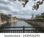 Gate and river surrounding the castle in Sendai, Japan with cherry blossoms