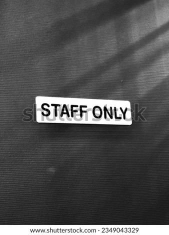 Gate for staff only , Staff only phase in front the door security text staff design, highlight quality photo.