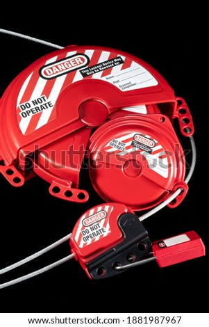 gate valve lockout system with cable lockout attached and secured by padlock