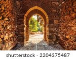 Gate of the Wall and the Gardens of the Alcazaba in the City of Malaga, Andalusia, Spain 