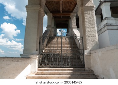 Gates, Columns, Corridors Of The Ancient Russian White-stone Church In The Tent Style. Stairway To Heaven. Strong Contrast Of Light And Shadow, Rhythm. Church Of The Ascension