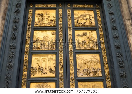 Gates of Paradise with Bible stories on door of Duomo Baptistry in Florence, Italy.  Architecture and landmarks of Florence