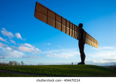 GATESHEAD, UK - MARCH 27, 2016. The Angel of the North, Gateshead. A steel sculpture by Antony Gormley, stands 66 feet high with a wing span of 177 feet. The sky is blue.