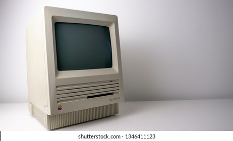 Gateshead, United Kingdom - March 22nd 2019: Apple Macintosh SE Vintage Retro, With Rainbow Logo, 80's Early 90's Personal Computer On White Background Sitting From Left To Right.